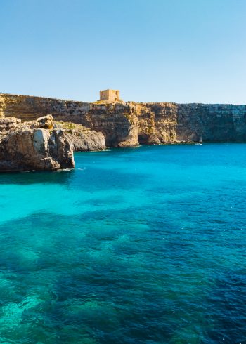 Comino island. Tower, Cliffs and blue lagoon. Malta country