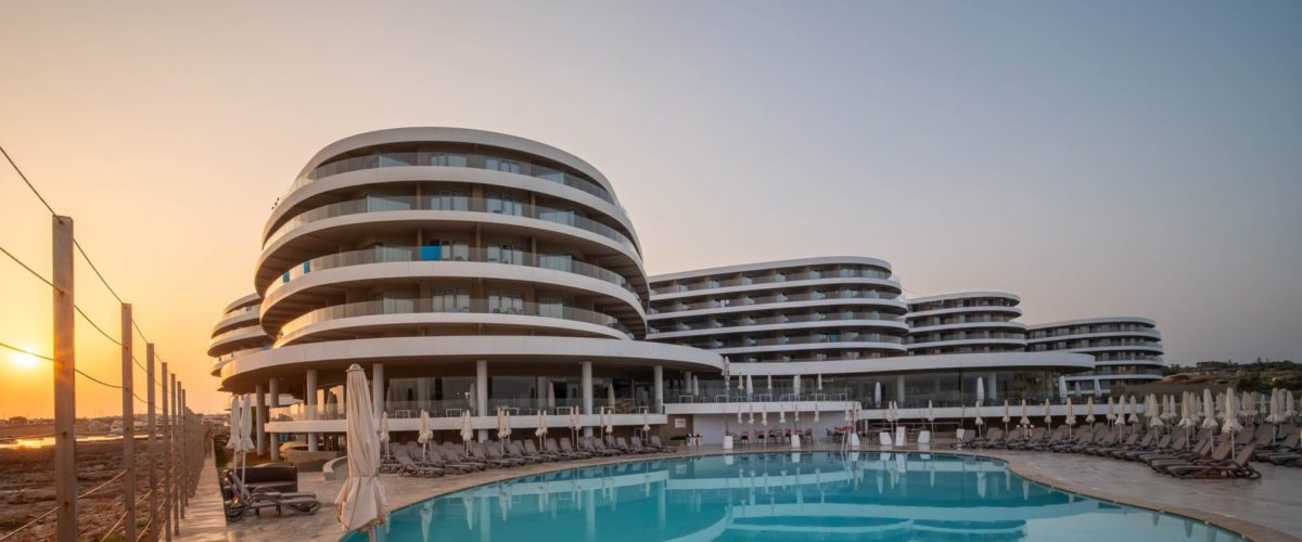 Ramla Bay Resort - Outdoor Pool - Sunrise